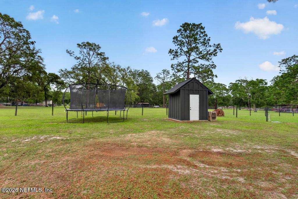 2955 Carroll Corner Road Hilliard, FL 32046 - Photo 93 of 106 a house view with a play ground in front of it