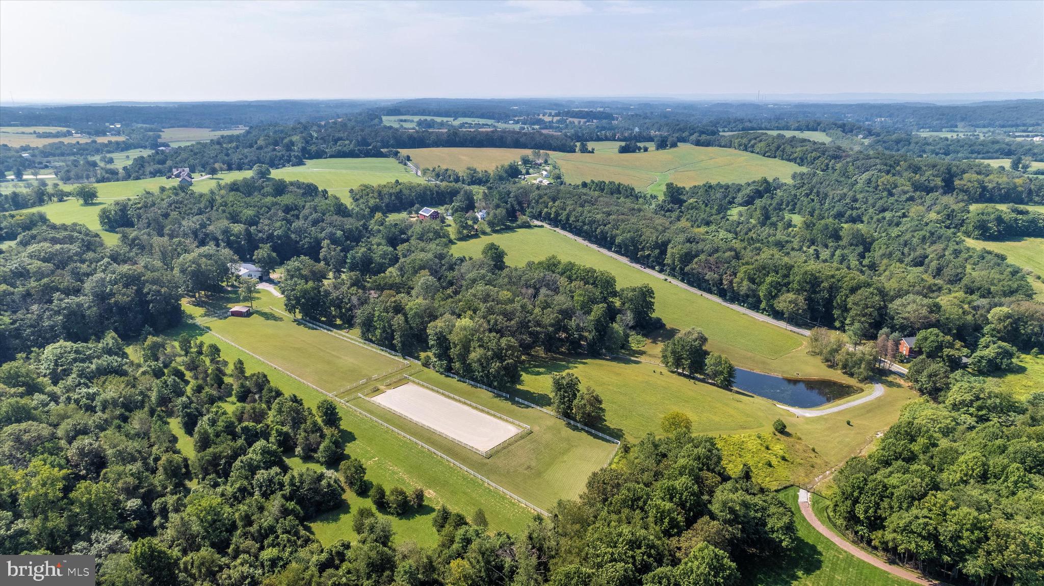 24701 Old Hundred Road Dickerson, MD 20842 - Photo 1 of 37 an aerial view of a house with a yard