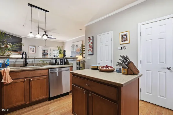 a kitchen with a sink a stove and cabinets