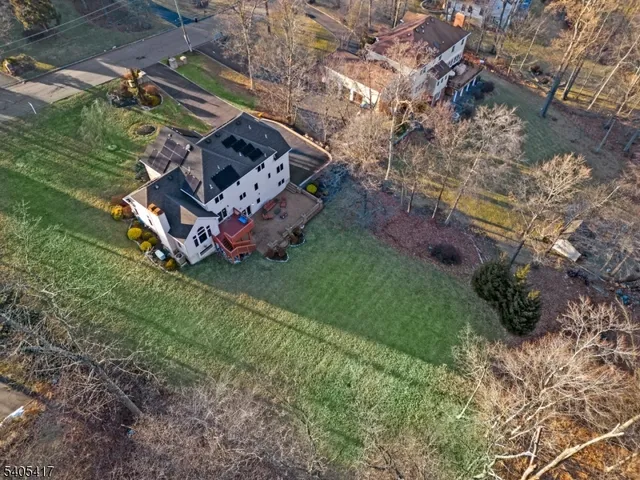 a green field with lots of trees
