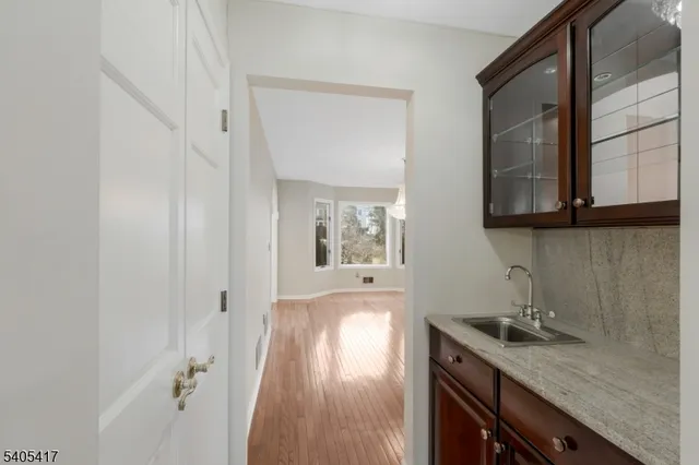 a kitchen with a sink and cabinets