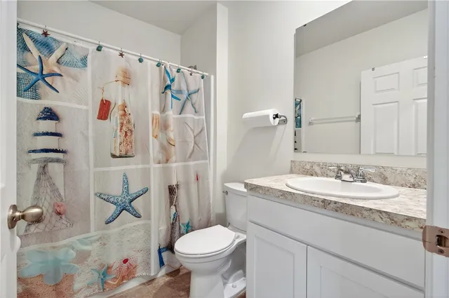 a bathroom with a sink and toilet