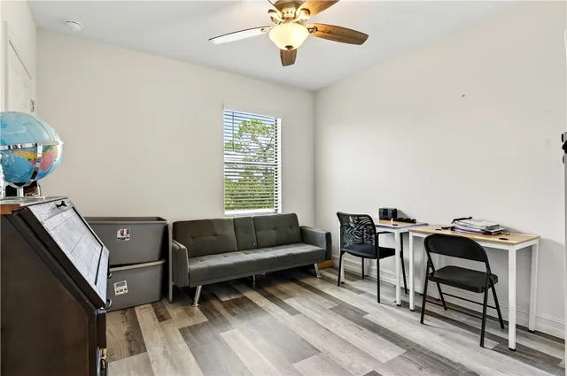 a living room with furniture and a window