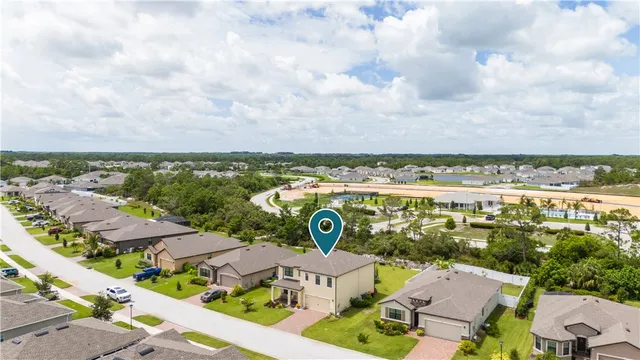 an aerial view of residential houses with outdoor space