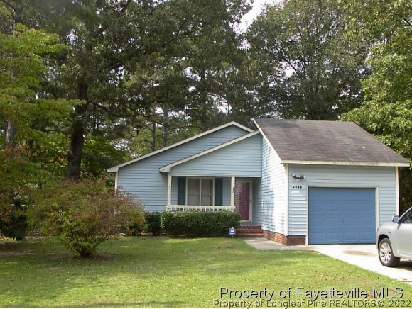 1686 Rim Road Fayetteville, NC 28314 - Photo 1 of 12 a view of a house with a yard