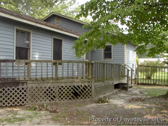 1686 Rim Road Fayetteville, NC 28314 - Photo 12 of 12 a view of a house with a yard