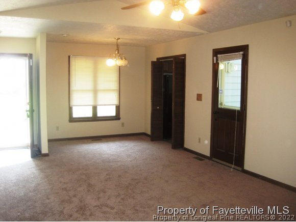 1686 Rim Road Fayetteville, NC 28314 - Photo 3 of 12 an empty room with windows and closet