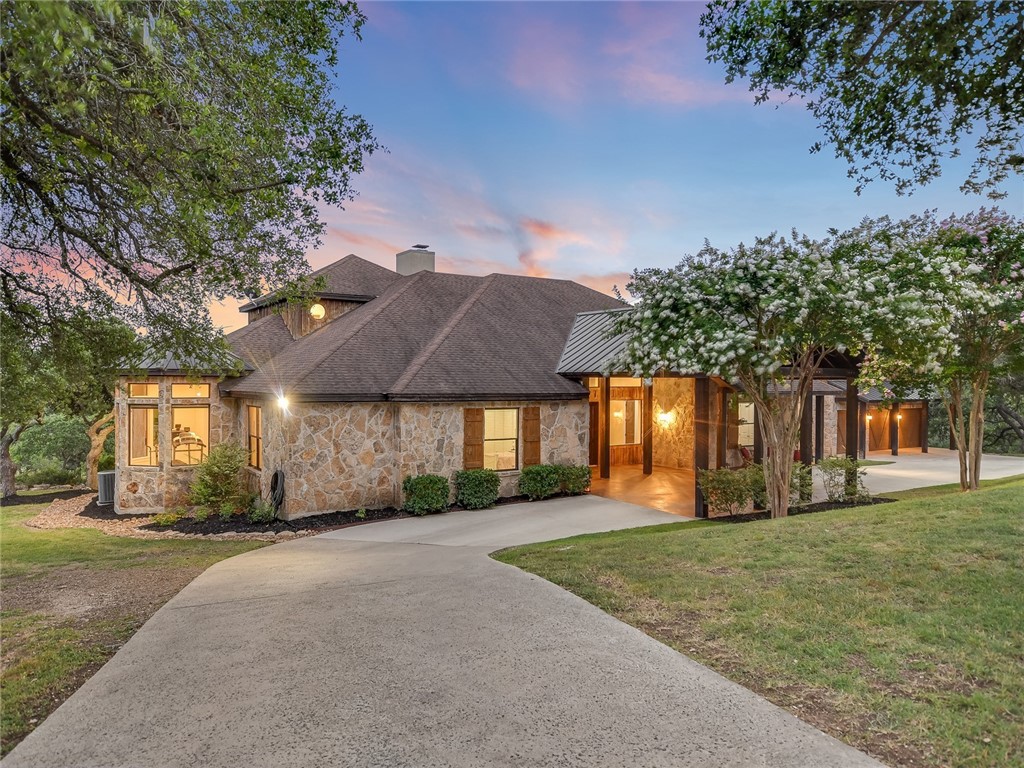 a front view of house with yard and green space