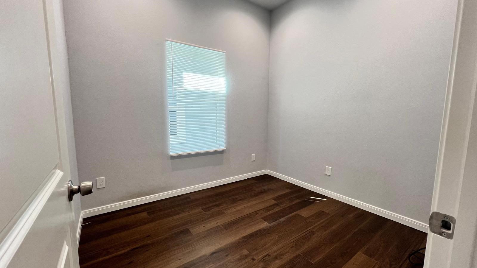 4922 Dalhart Dr Spring Spring, TX 77379 - Photo 16 of 33 a room with a window and wooden floor