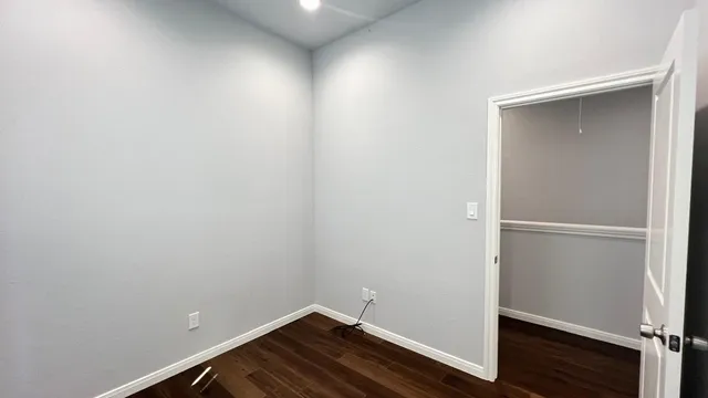 a view of small space with wooden floor