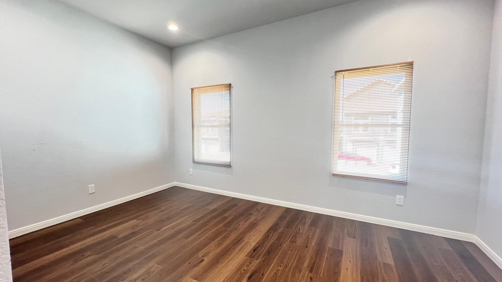 4922 Dalhart Dr Spring Spring, TX 77379 - Photo 24 of 33 an empty room with wooden floor and windows
