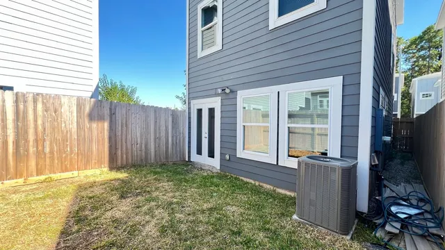 a view of a house with backyard and porch