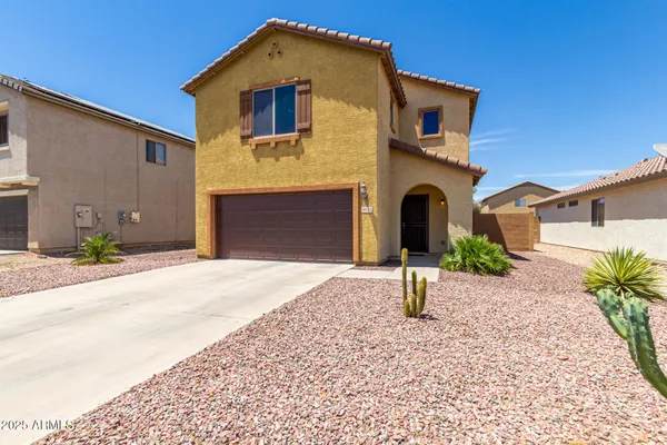 a front view of a house with parking
