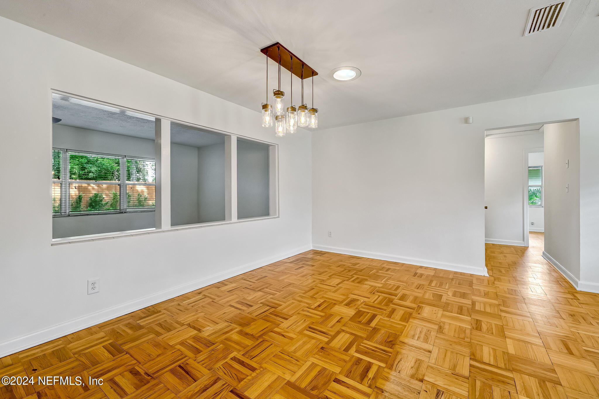 5614 Capri Road Jacksonville, FL 32244 - Photo 14 of 45 a view of an empty room with glass door