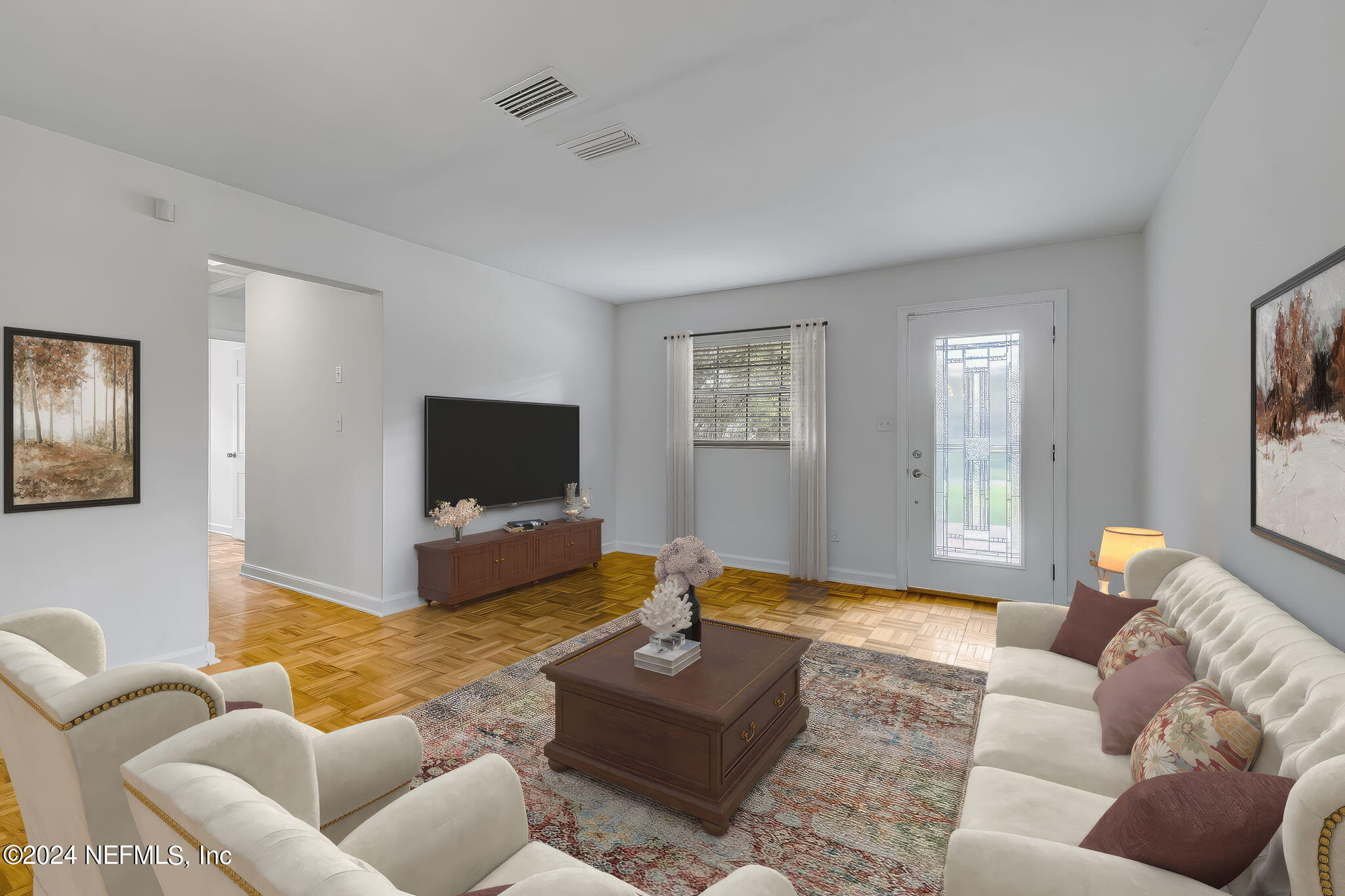 5614 Capri Road Jacksonville, FL 32244 - Photo 2 of 45 a living room with furniture and a flat screen tv