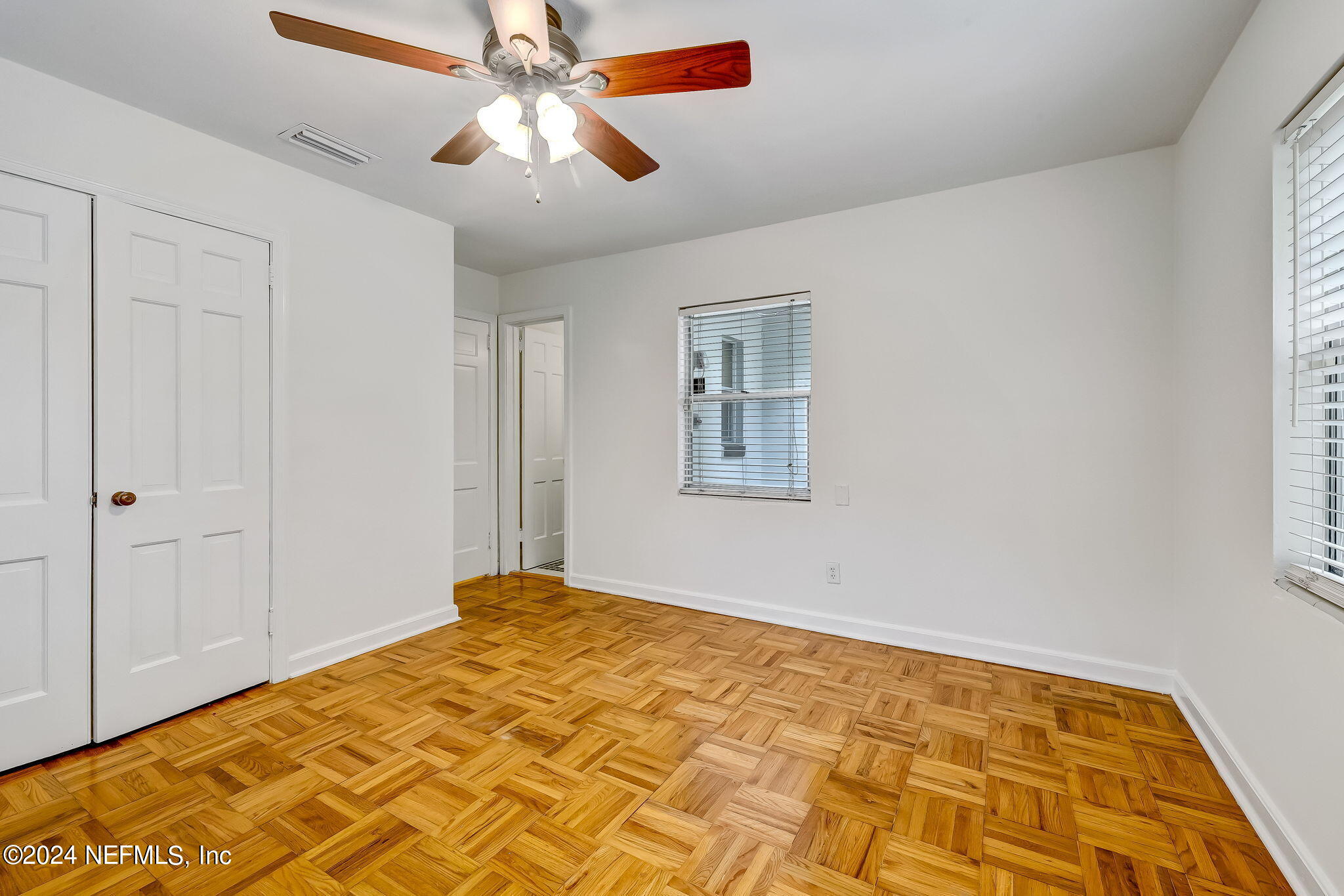 5614 Capri Road Jacksonville, FL 32244 - Photo 37 of 45 a bedroom with bed and a window