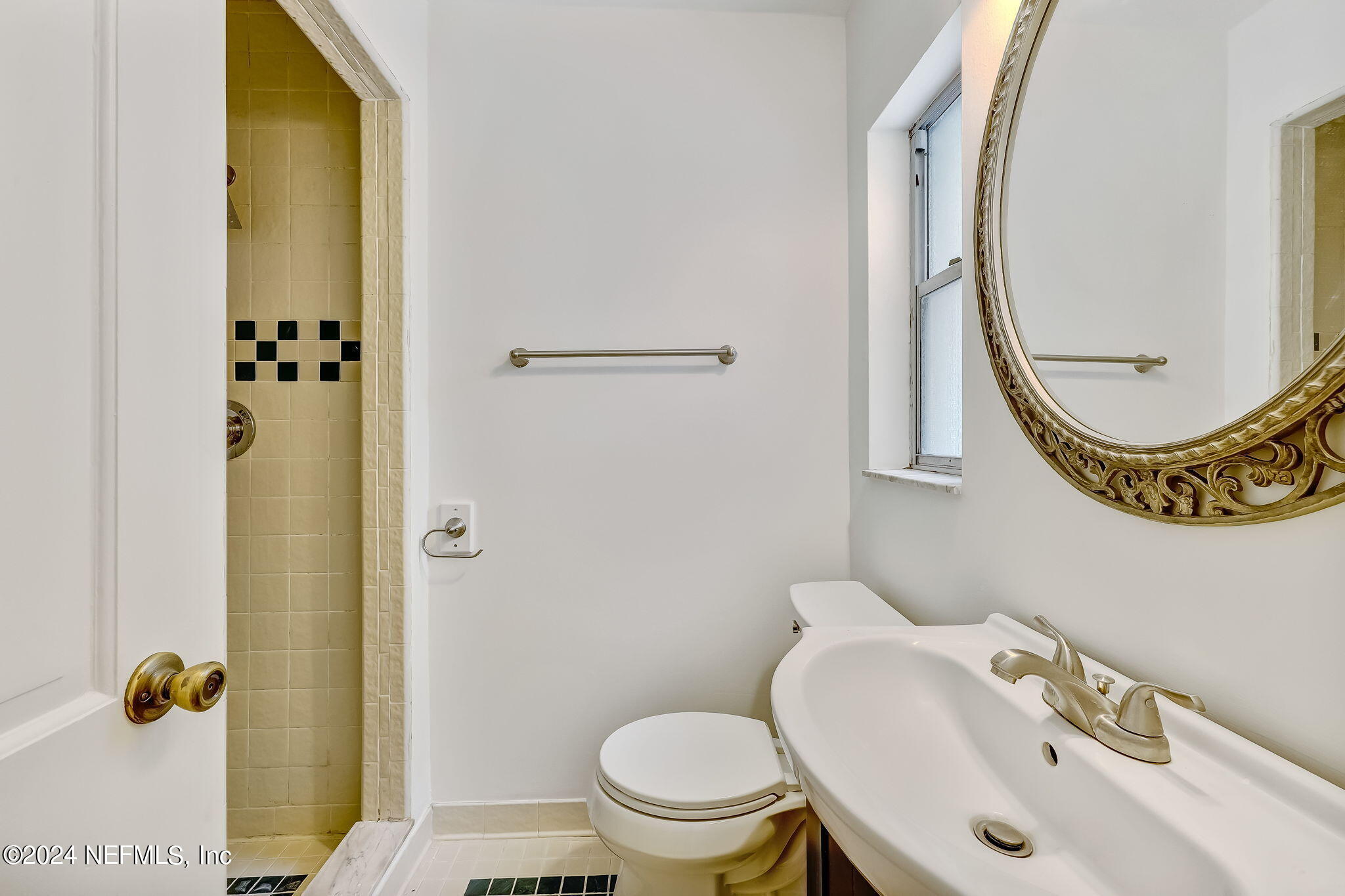 5614 Capri Road Jacksonville, FL 32244 - Photo 39 of 45 a bathroom with a sink and a mirror