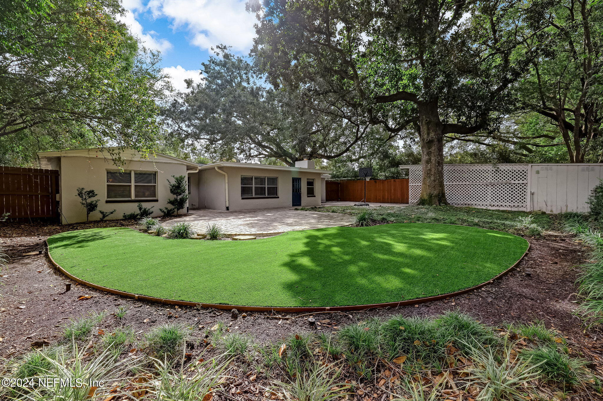 5614 Capri Road Jacksonville, FL 32244 - Photo 9 of 45 a view of a house with a backyard and a patio