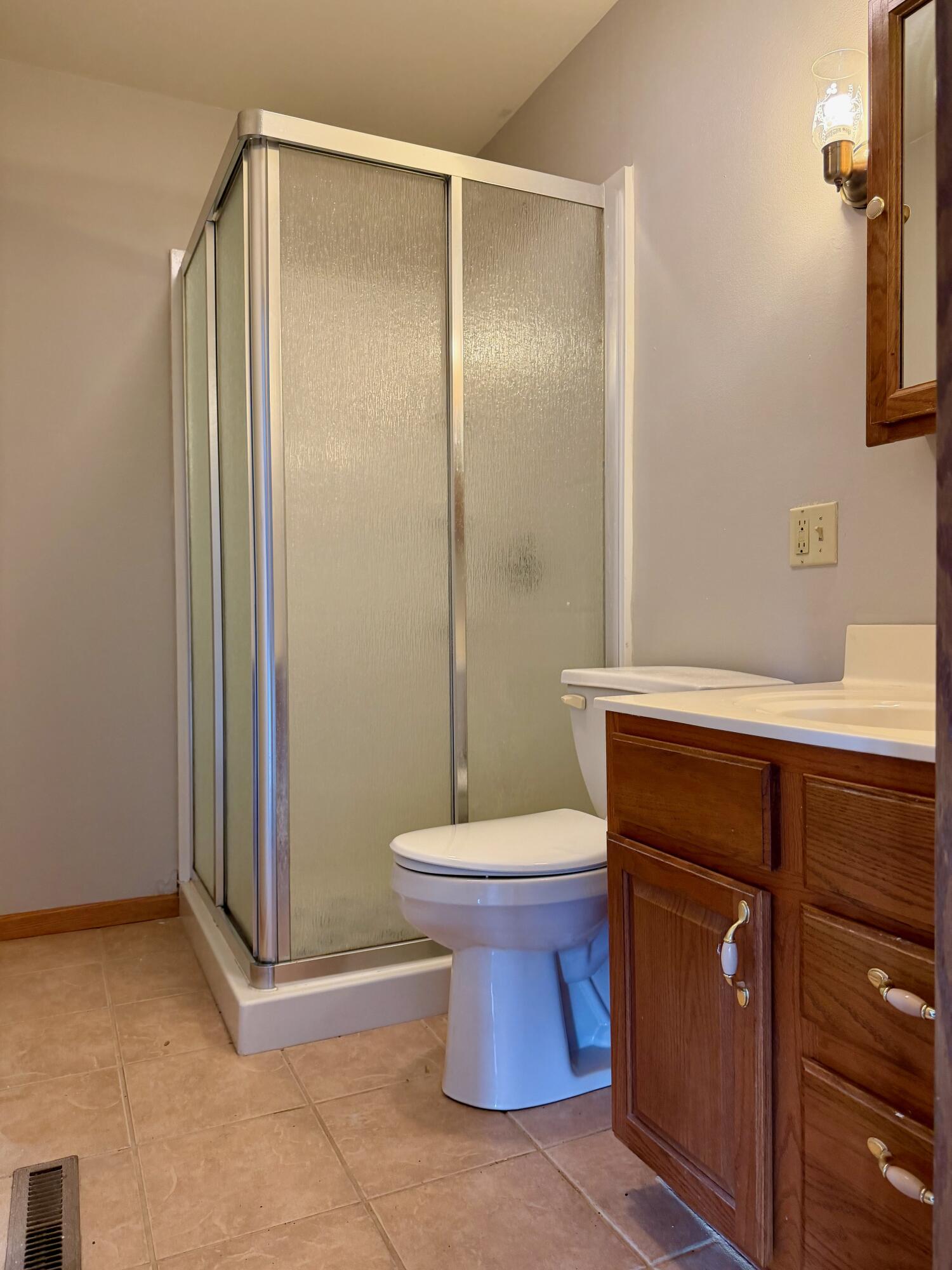 5831 West 700 North Winamac, IN 46996 - Photo 13 of 22 a bathroom with a sink a toilet and shower