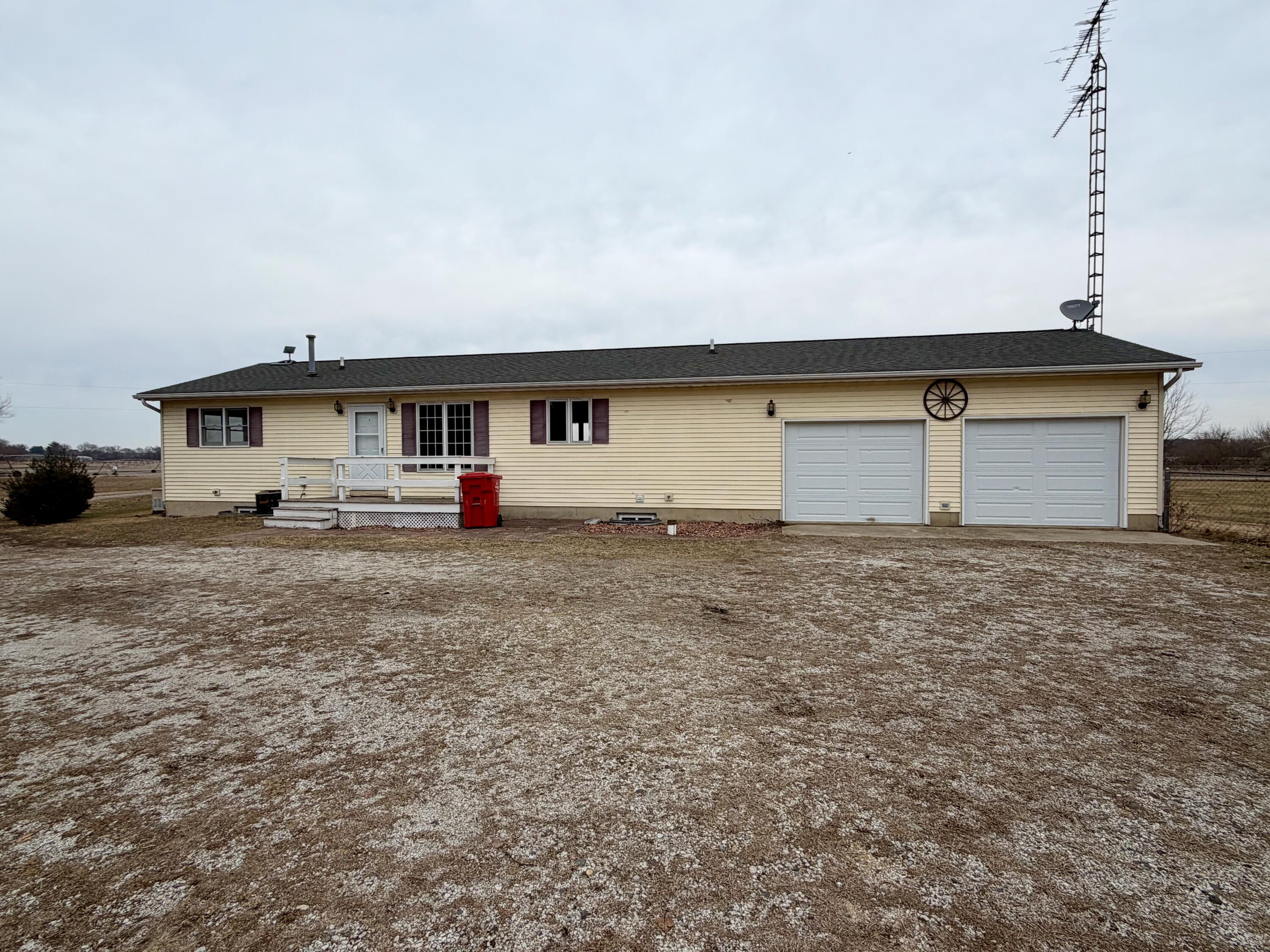 5831 West 700 North Winamac, IN 46996 - Photo 16 of 22 a backyard of a house with table and chairs