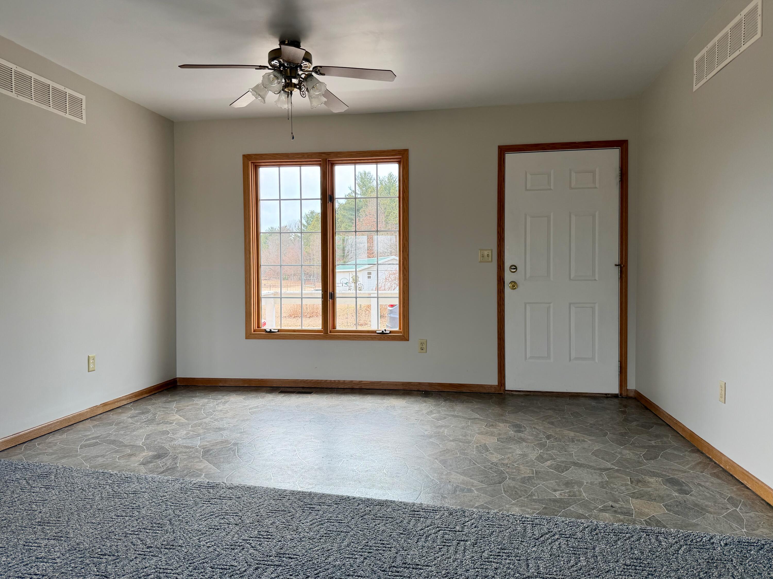 5831 West 700 North Winamac, IN 46996 - Photo 8 of 22 a view of room with a ceiling fan and window