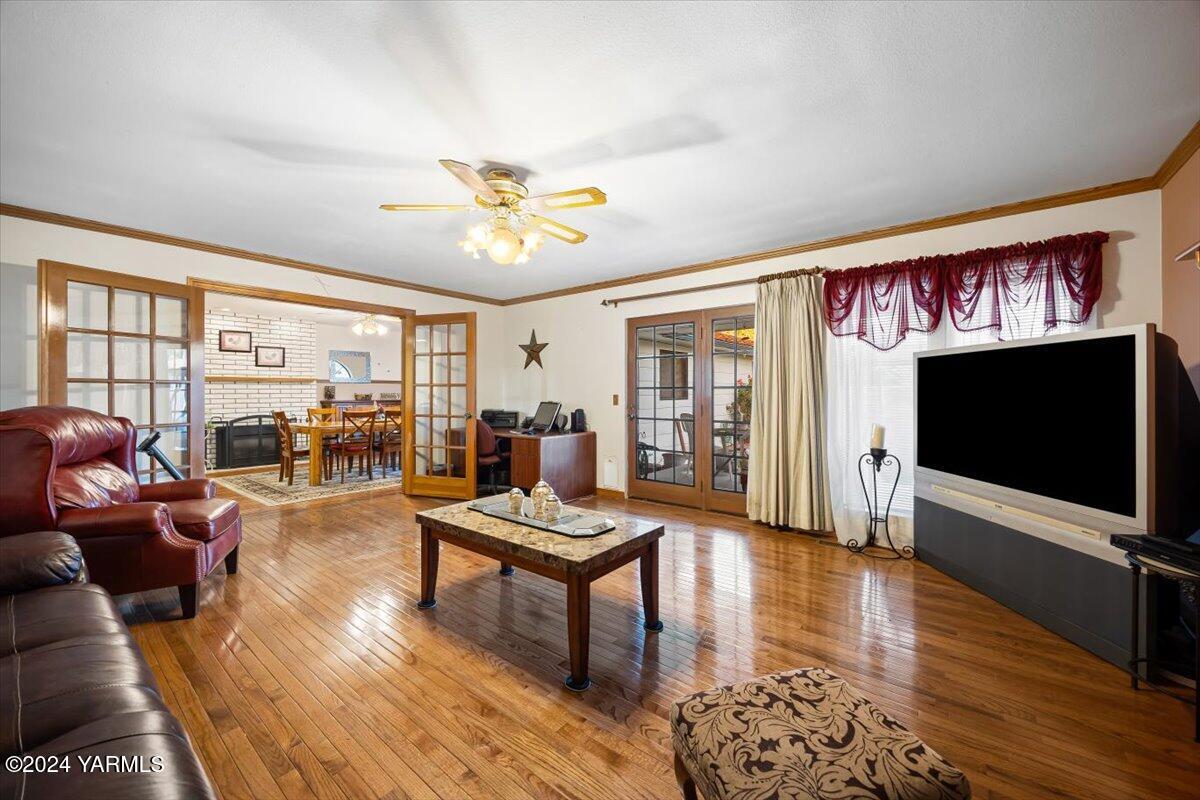 1802 Young Street Grandview, WA 98930 - Photo 19 of 31 a living room with furniture flat screen tv and wooden floor