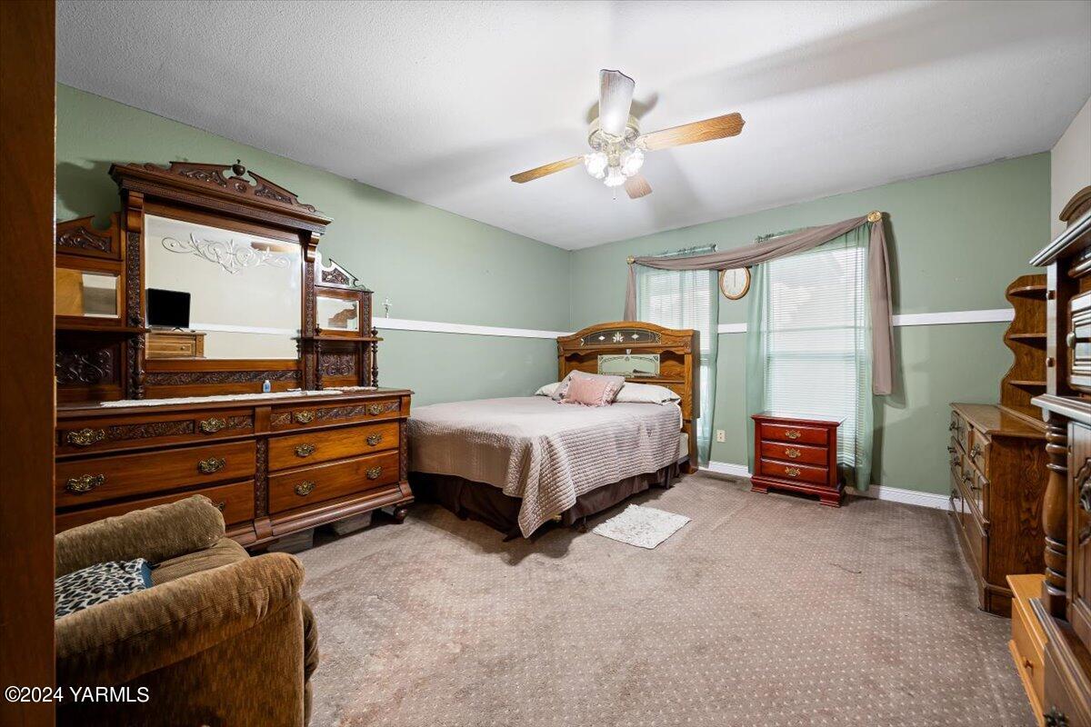 1802 Young Street Grandview, WA 98930 - Photo 26 of 31 a bedroom with a bed and furniture