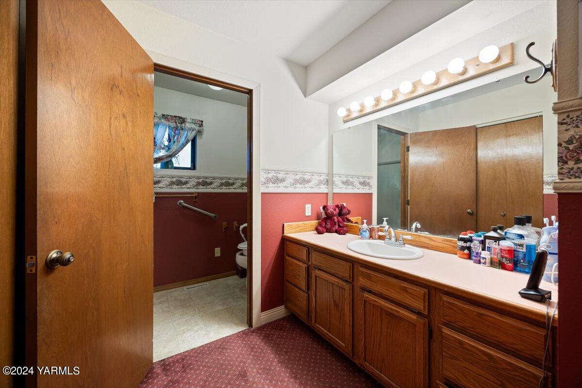 1802 Young Street Grandview, WA 98930 - Photo 9 of 31 a bathroom with a double vanity sink mirror and double