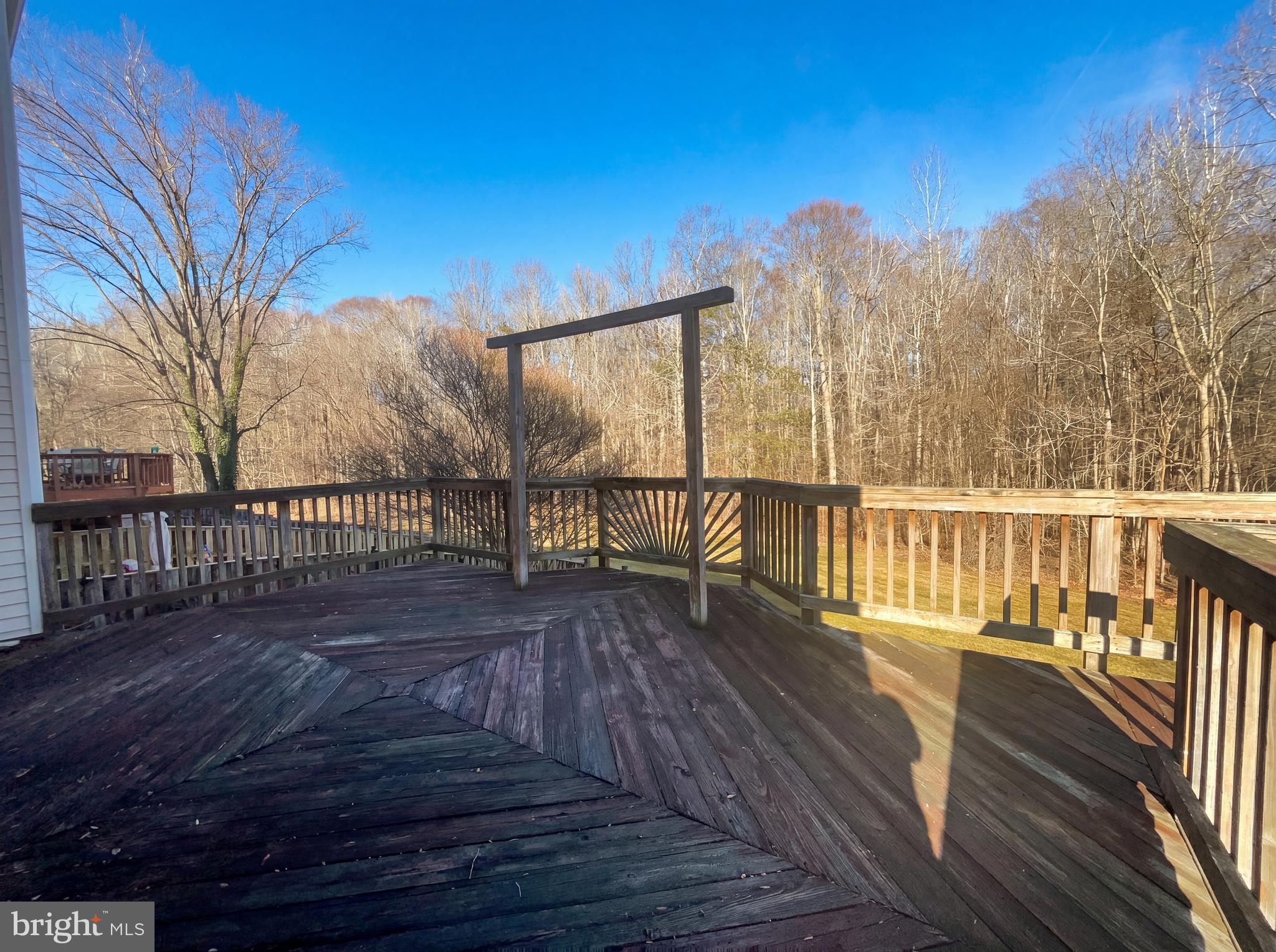 6352 Shaundale Drive Springfield, VA 22152 - Photo 19 of 50 a view of balcony with wooden floor and fence