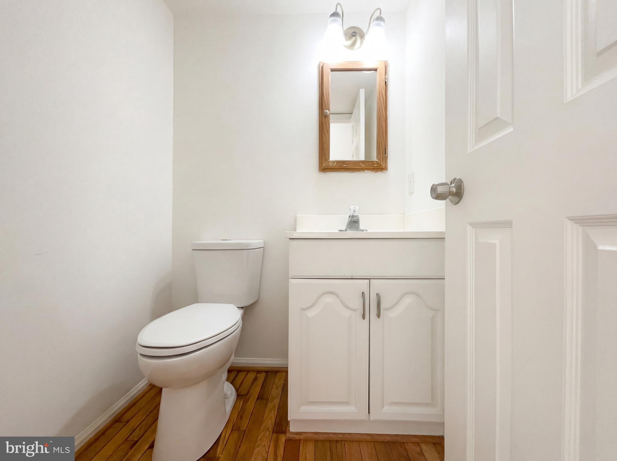 6352 Shaundale Drive Springfield, VA 22152 - Photo 34 of 50 a bathroom with a sink toilet and a mirror