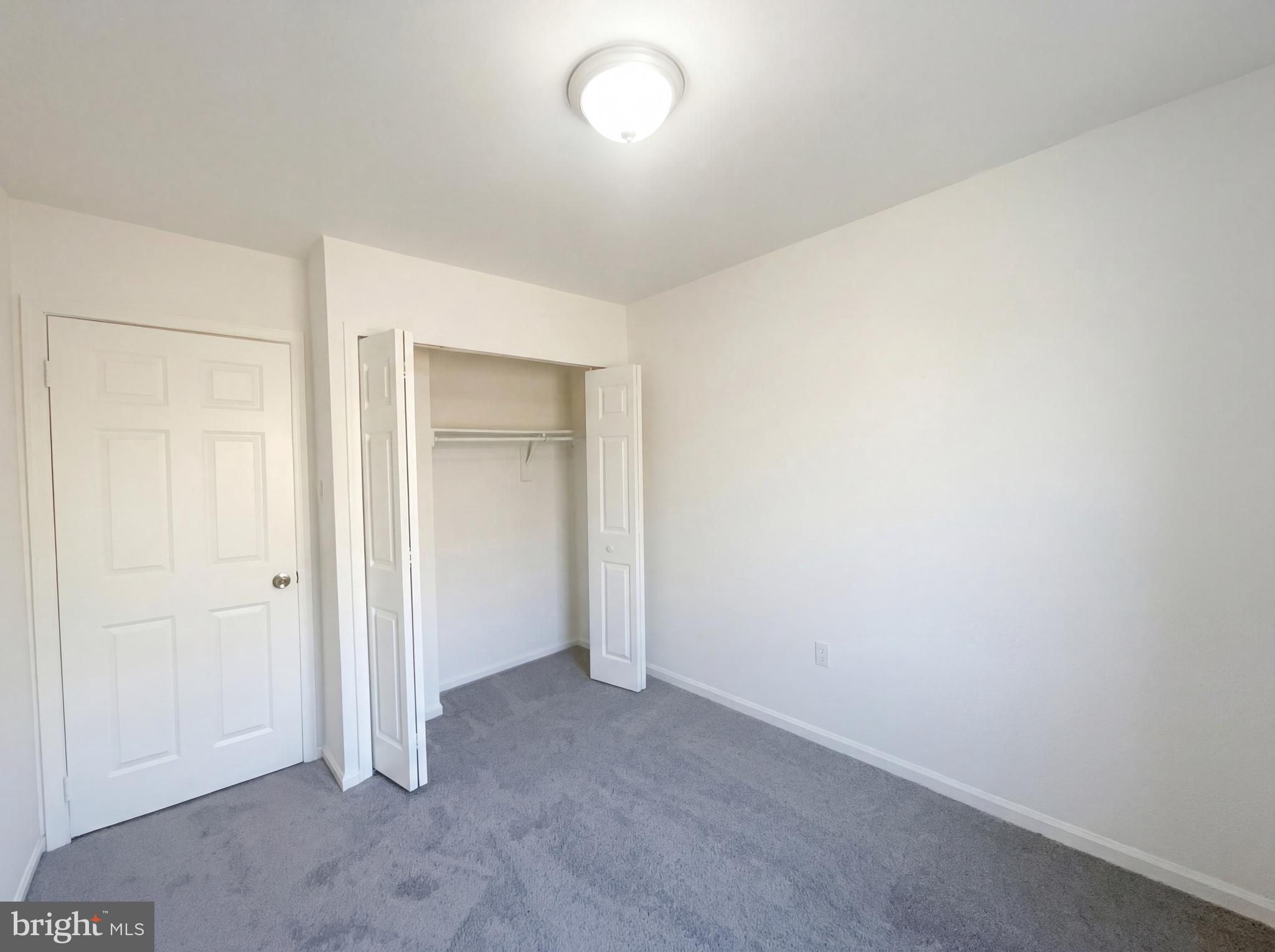 6352 Shaundale Drive Springfield, VA 22152 - Photo 39 of 50 an empty room with closet and windows