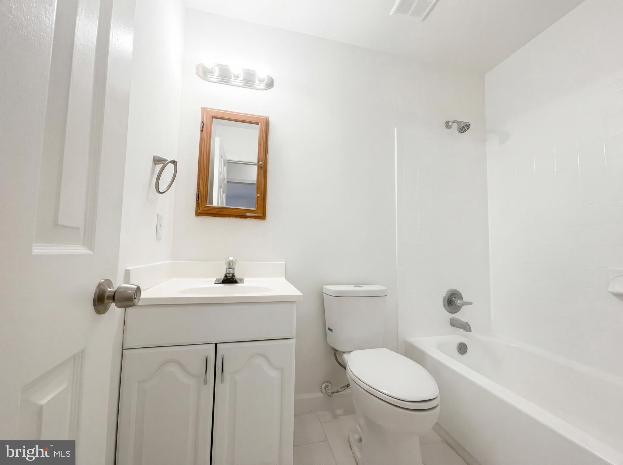 6352 Shaundale Drive Springfield, VA 22152 - Photo 42 of 50 a bathroom with a toilet sink and mirror