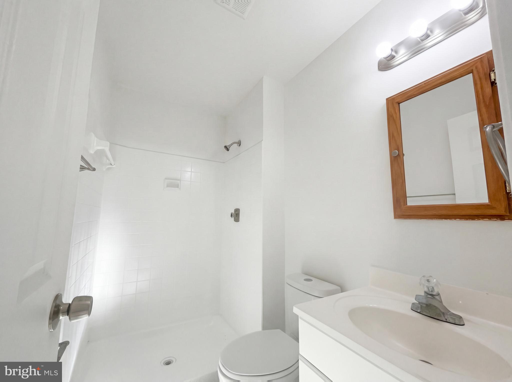 6352 Shaundale Drive Springfield, VA 22152 - Photo 47 of 50 a bathroom with a sink toilet and shower