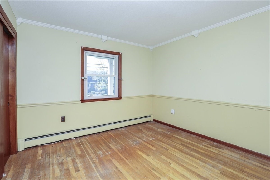 19 Longbow Road Danvers, MA 01923 - Photo 21 of 39 an empty room with wooden floor and windows