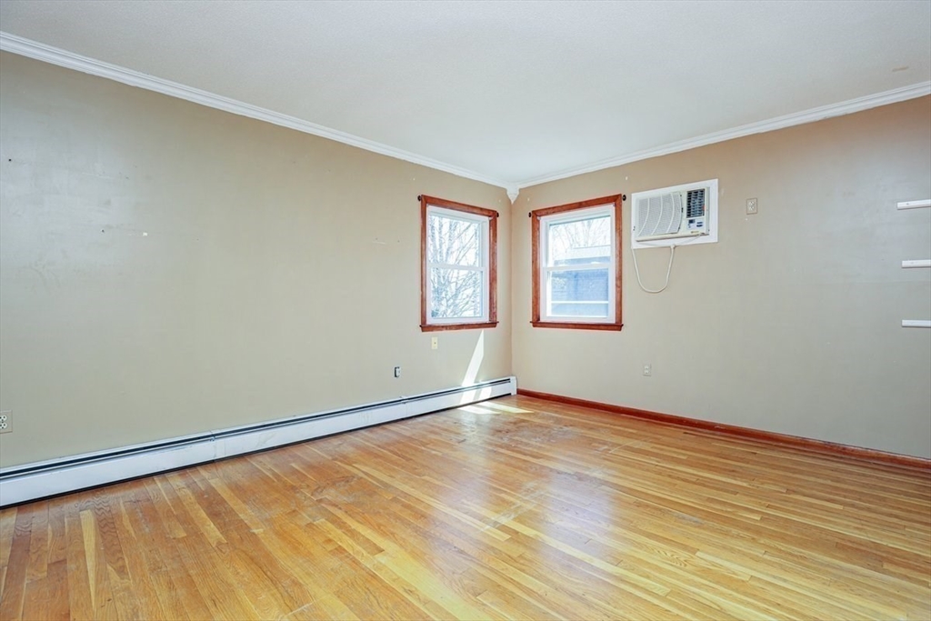 19 Longbow Road Danvers, MA 01923 - Photo 23 of 39 a view of an empty room with wooden floor and a window