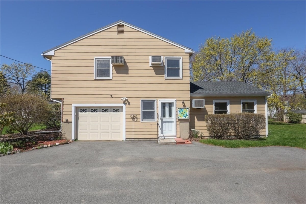 19 Longbow Road Danvers, MA 01923 - Photo 24 of 39 a front view of a house with a yard