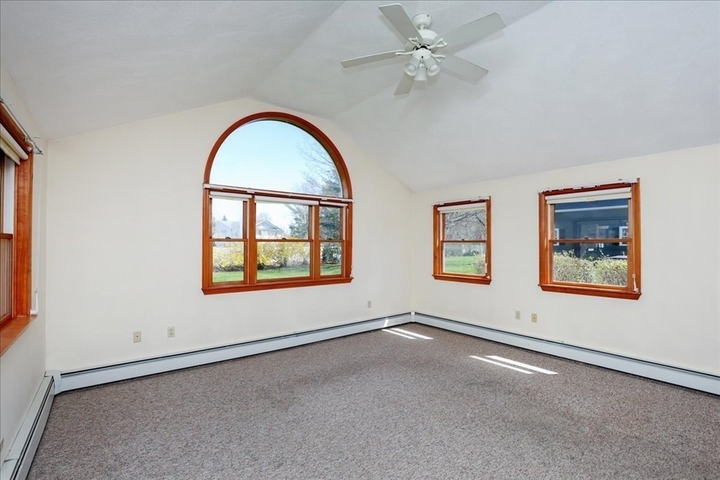 19 Longbow Road Danvers, MA 01923 - Photo 29 of 39 an empty room with a window and a ceiling fan