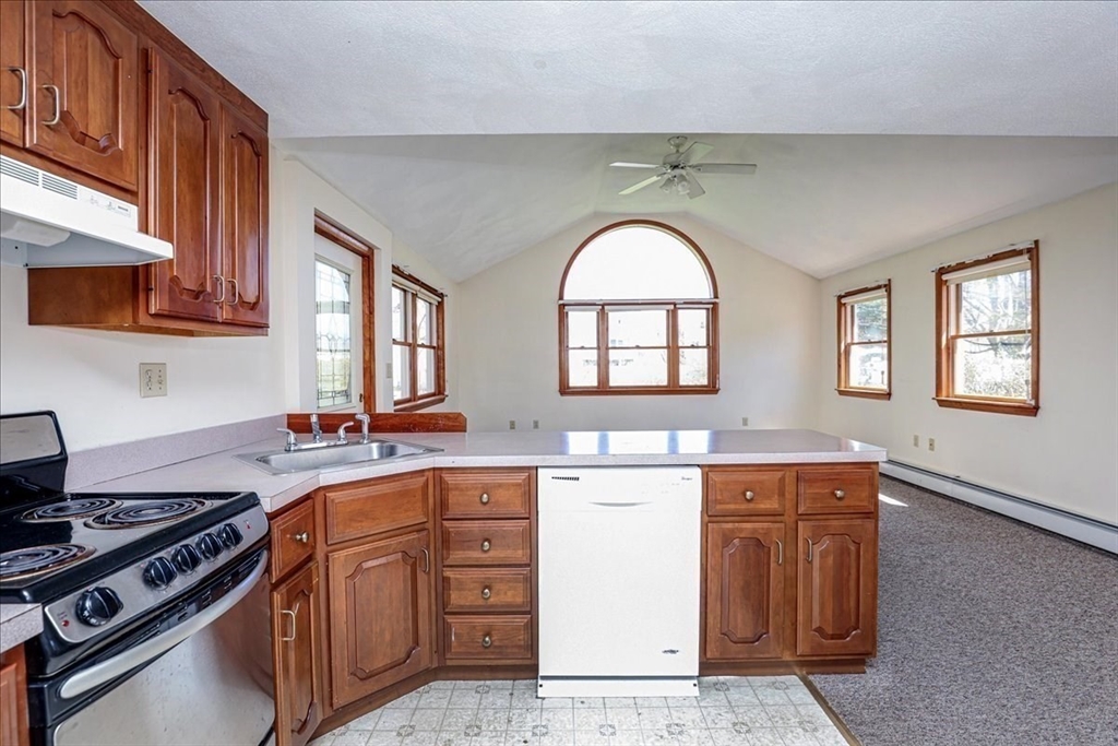 19 Longbow Road Danvers, MA 01923 - Photo 33 of 39 a kitchen with a stove a sink and a window