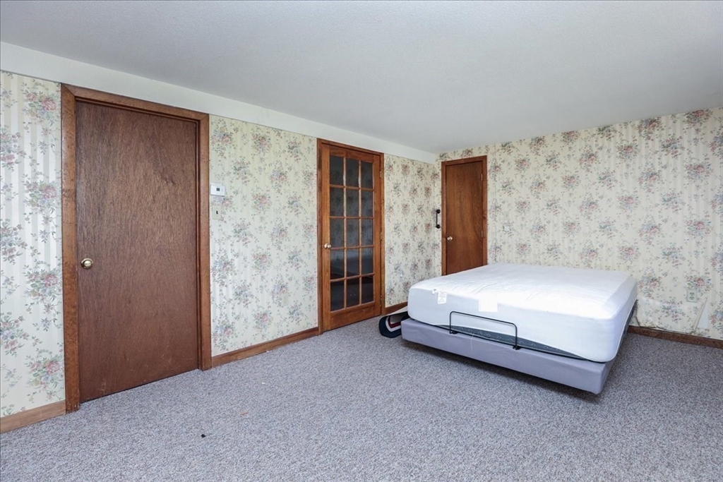 19 Longbow Road Danvers, MA 01923 - Photo 38 of 39 a spacious bedroom with a bed and a window