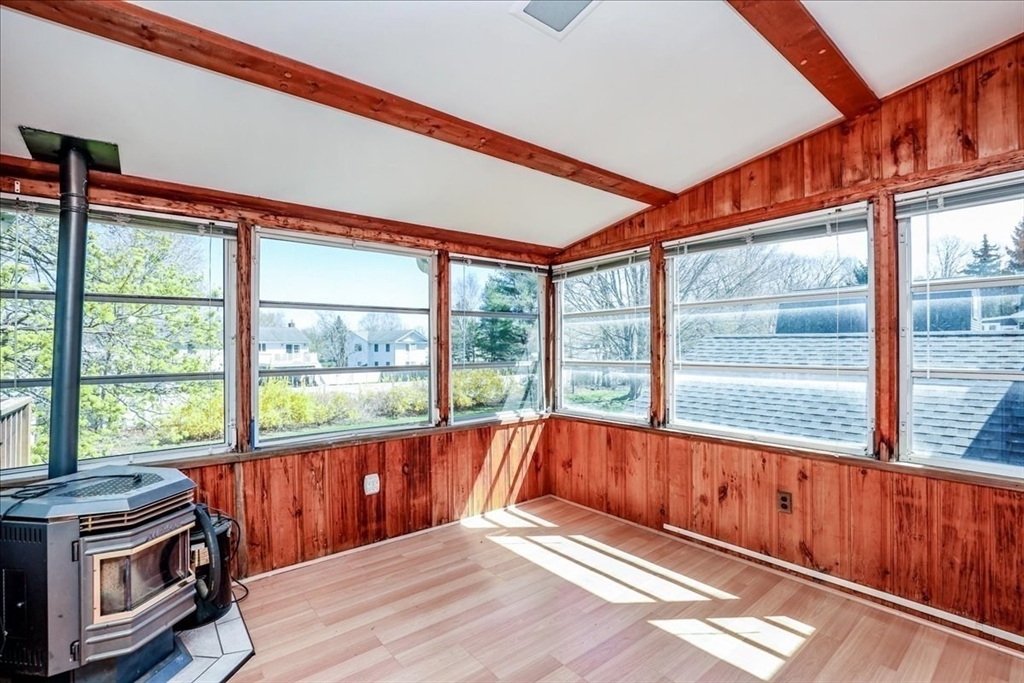 19 Longbow Road Danvers, MA 01923 - Photo 7 of 39 a view of an empty room with wooden floor and a window