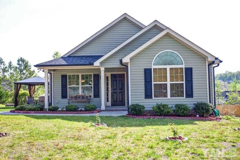 103 Orkney Road Stem, NC 27581 - Photo 1 of 25 a front view of a house with a yard
