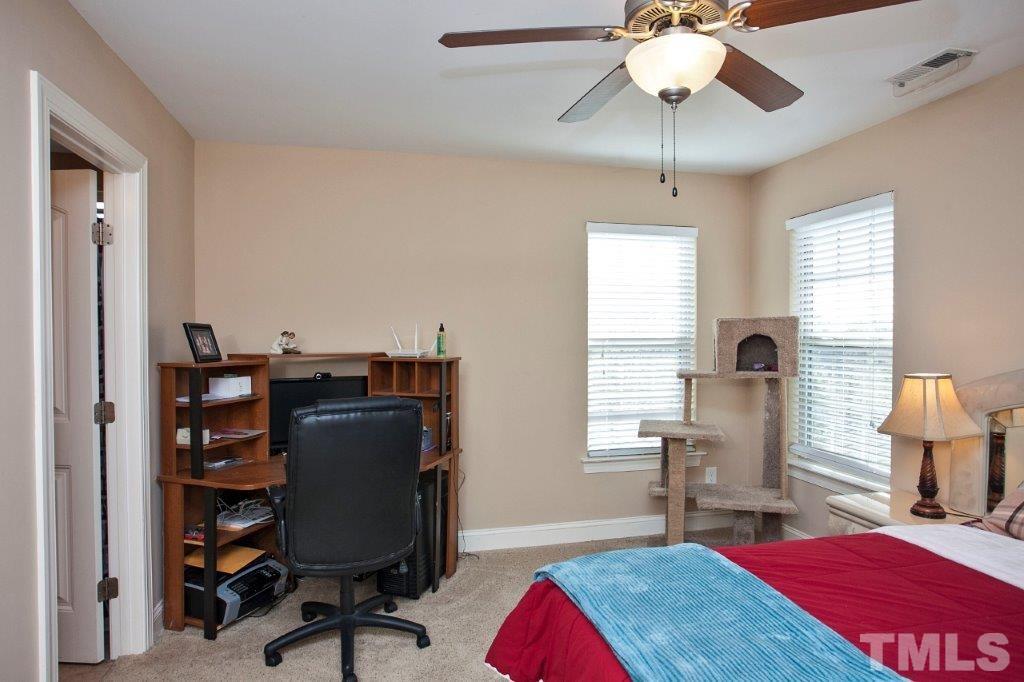 103 Orkney Road Stem, NC 27581 - Photo 12 of 25 a view of a workspace with furniture and a window