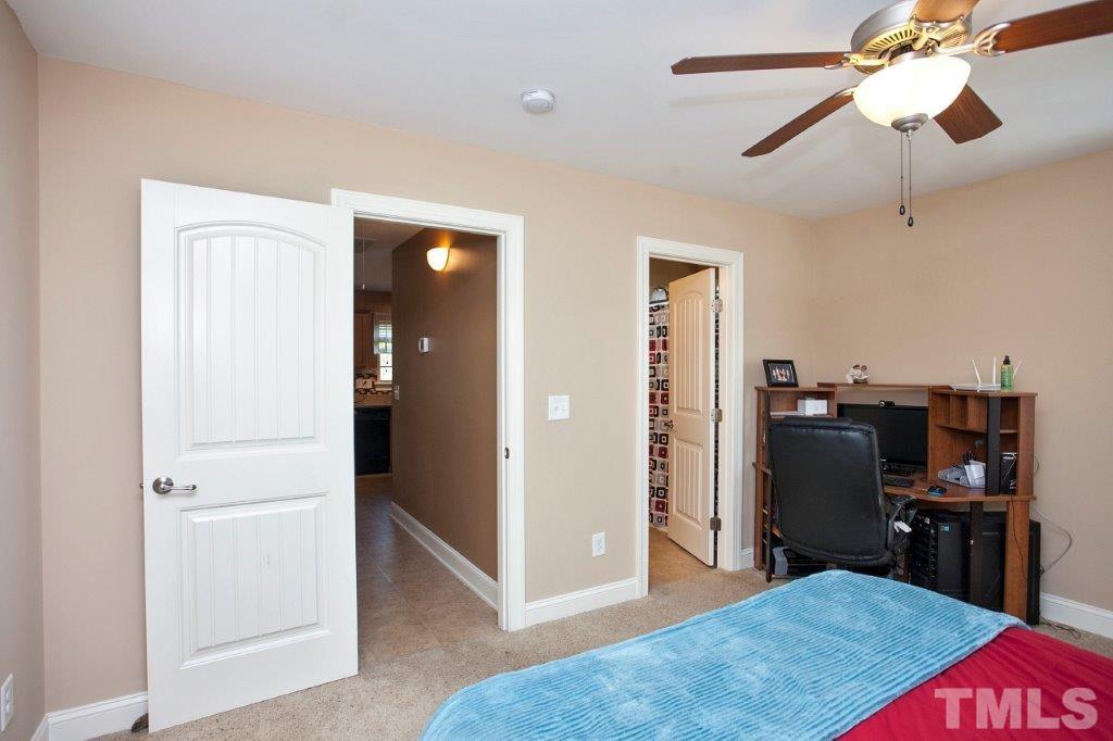 103 Orkney Road Stem, NC 27581 - Photo 13 of 25 a bedroom with a bed and furniture