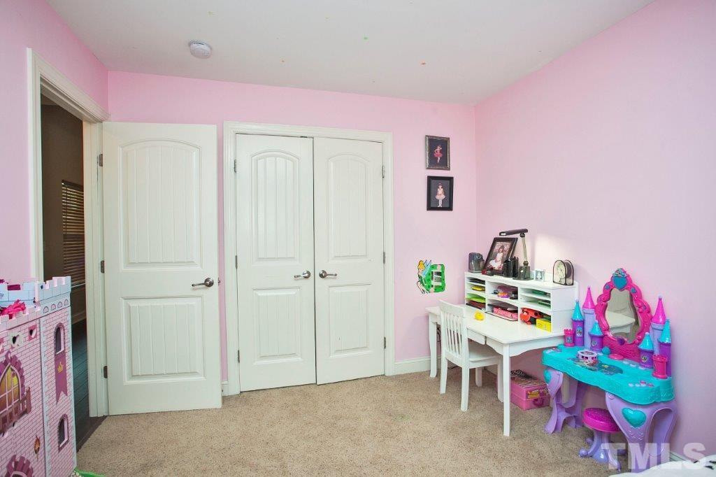 103 Orkney Road Stem, NC 27581 - Photo 17 of 25 a view of a bedroom with baby bed toys and toys