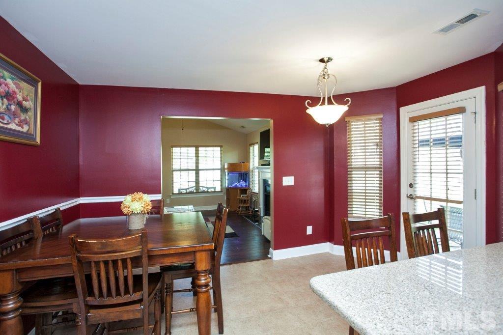 103 Orkney Road Stem, NC 27581 - Photo 10 of 25 a view of a dining room with furniture and window