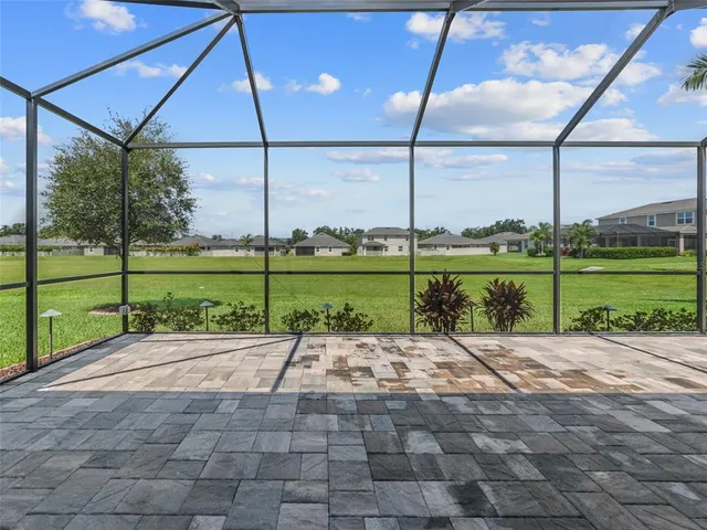 a view of a road with a big yard