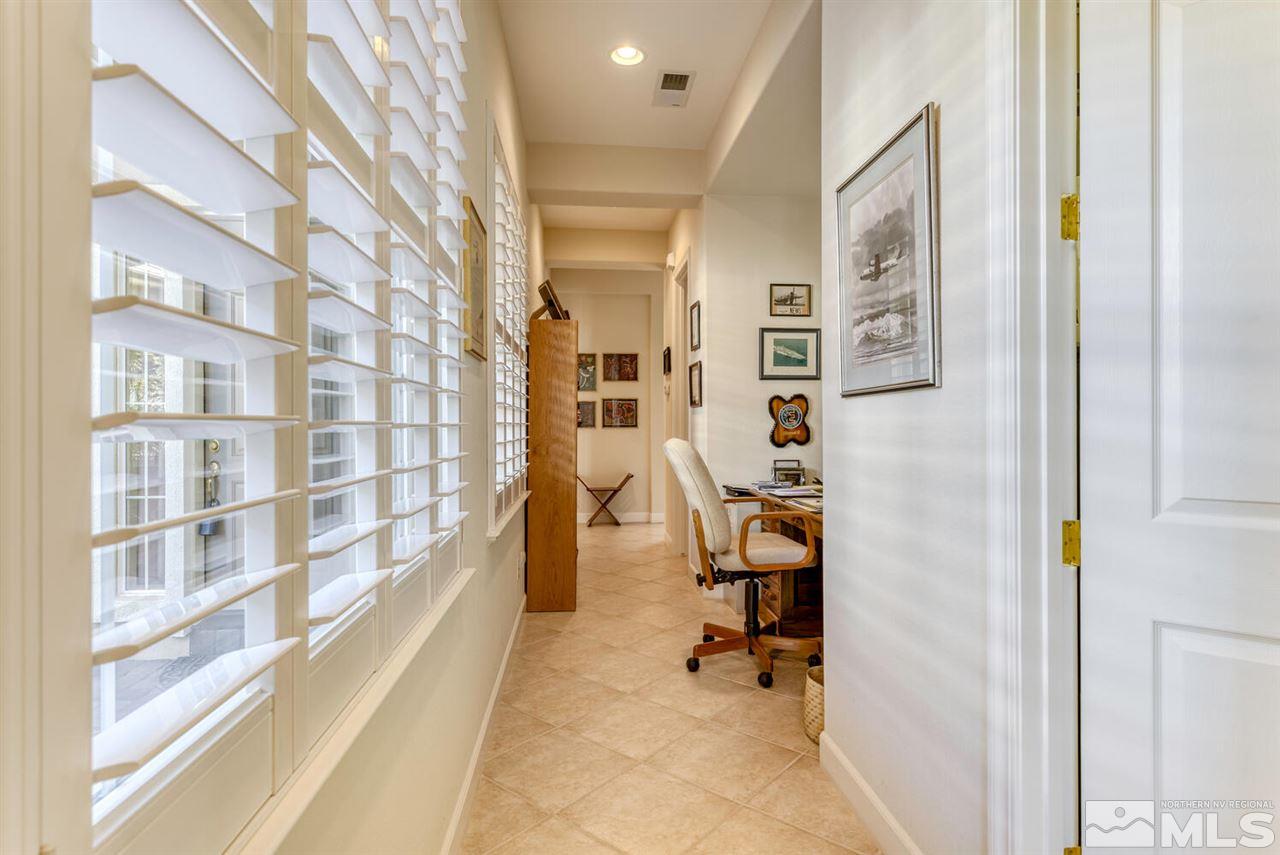10040 Burghley Lane Reno, NV 89521 - Photo 28 of 39 a view of a bedroom with workspace and entryway
