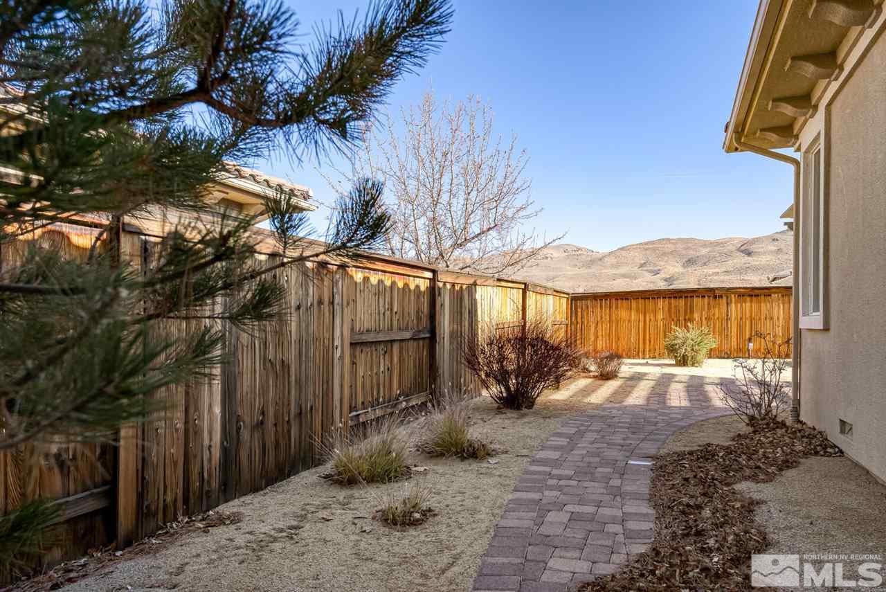 10040 Burghley Lane Reno, NV 89521 - Photo 38 of 39 a view of a backyard with a tree