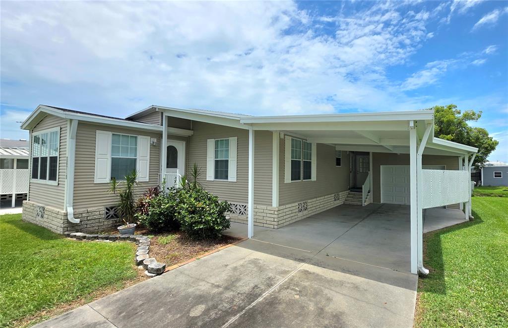 36740 Strand Drive Zephyrhills, FL 33542 - Photo 2 of 74 front view of house with a yard