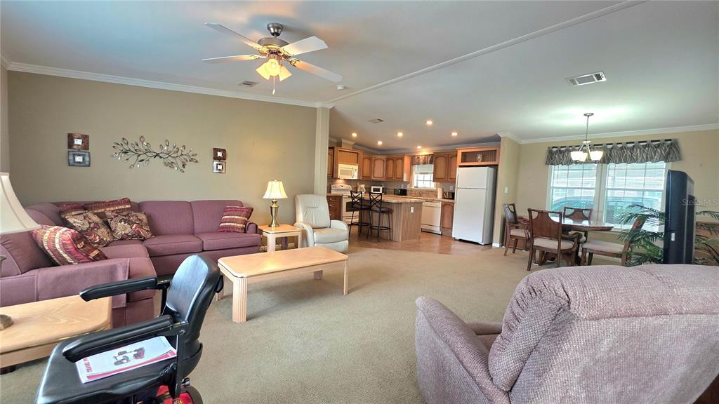 36740 Strand Drive Zephyrhills, FL 33542 - Photo 25 of 74 a living room with furniture and a large window